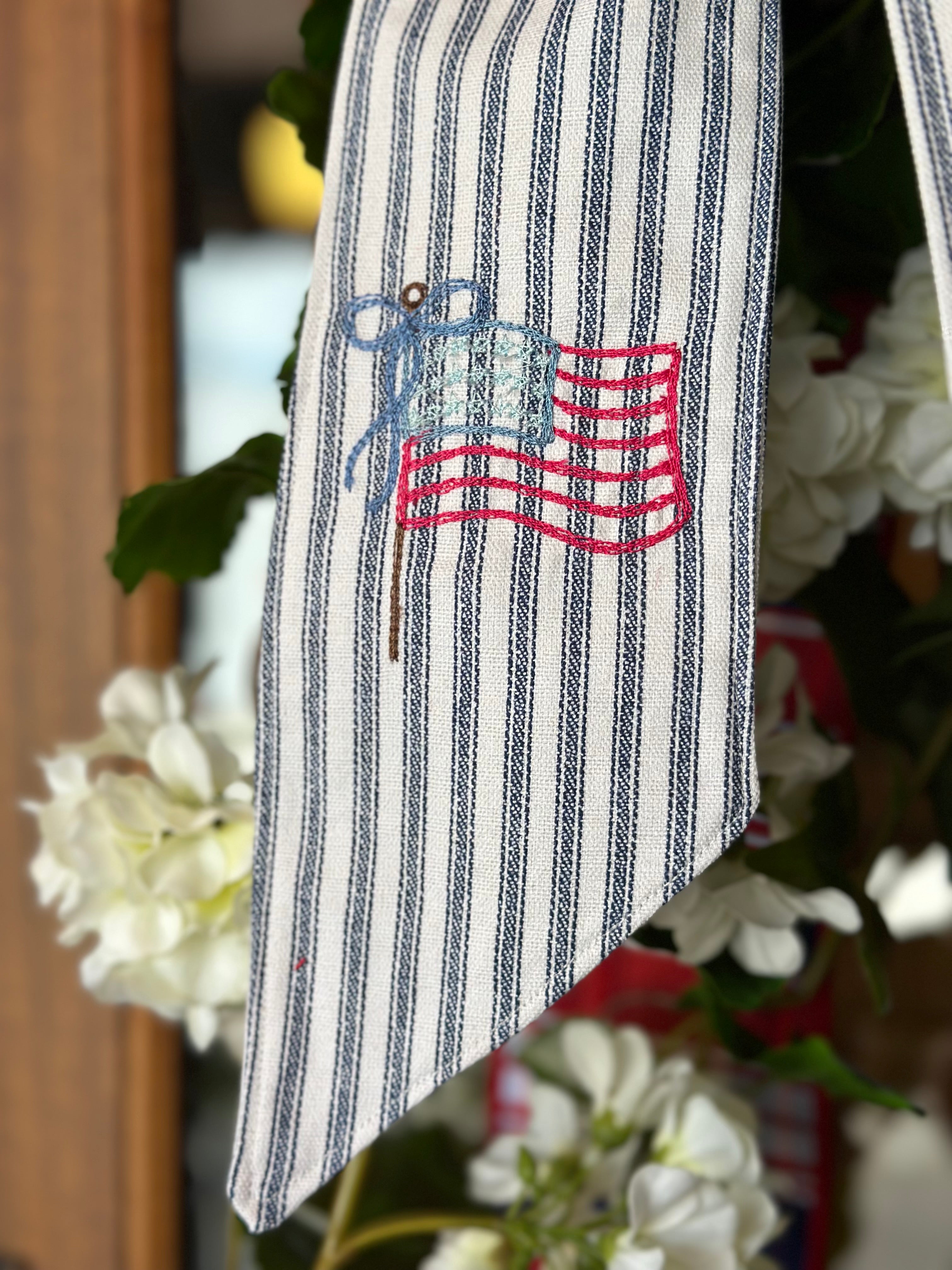 UV-Protected White Geranium and Ivy Swag with Embroidered American Flag Sash
