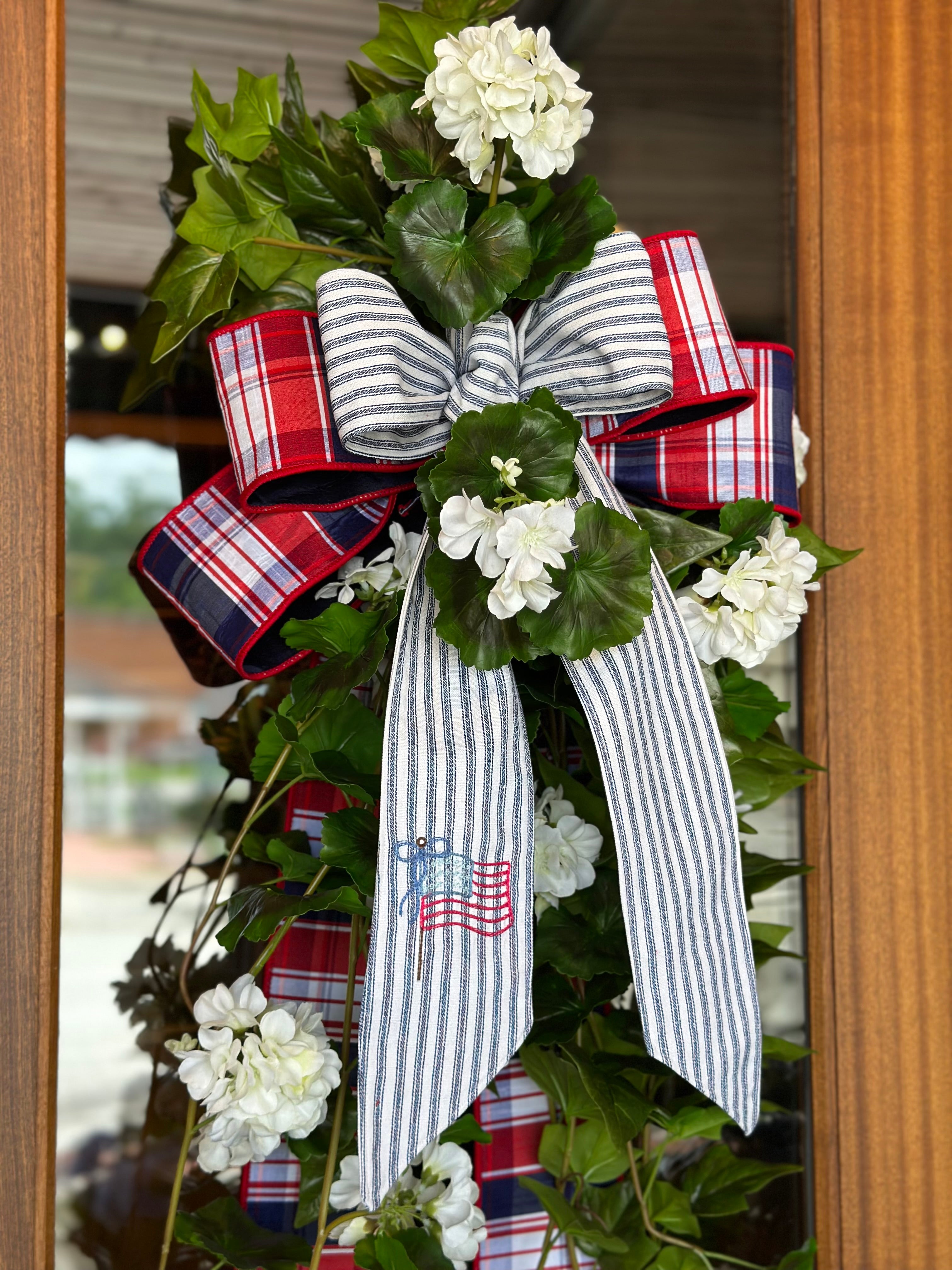 UV-Protected White Geranium and Ivy Swag with Embroidered American Flag Sash