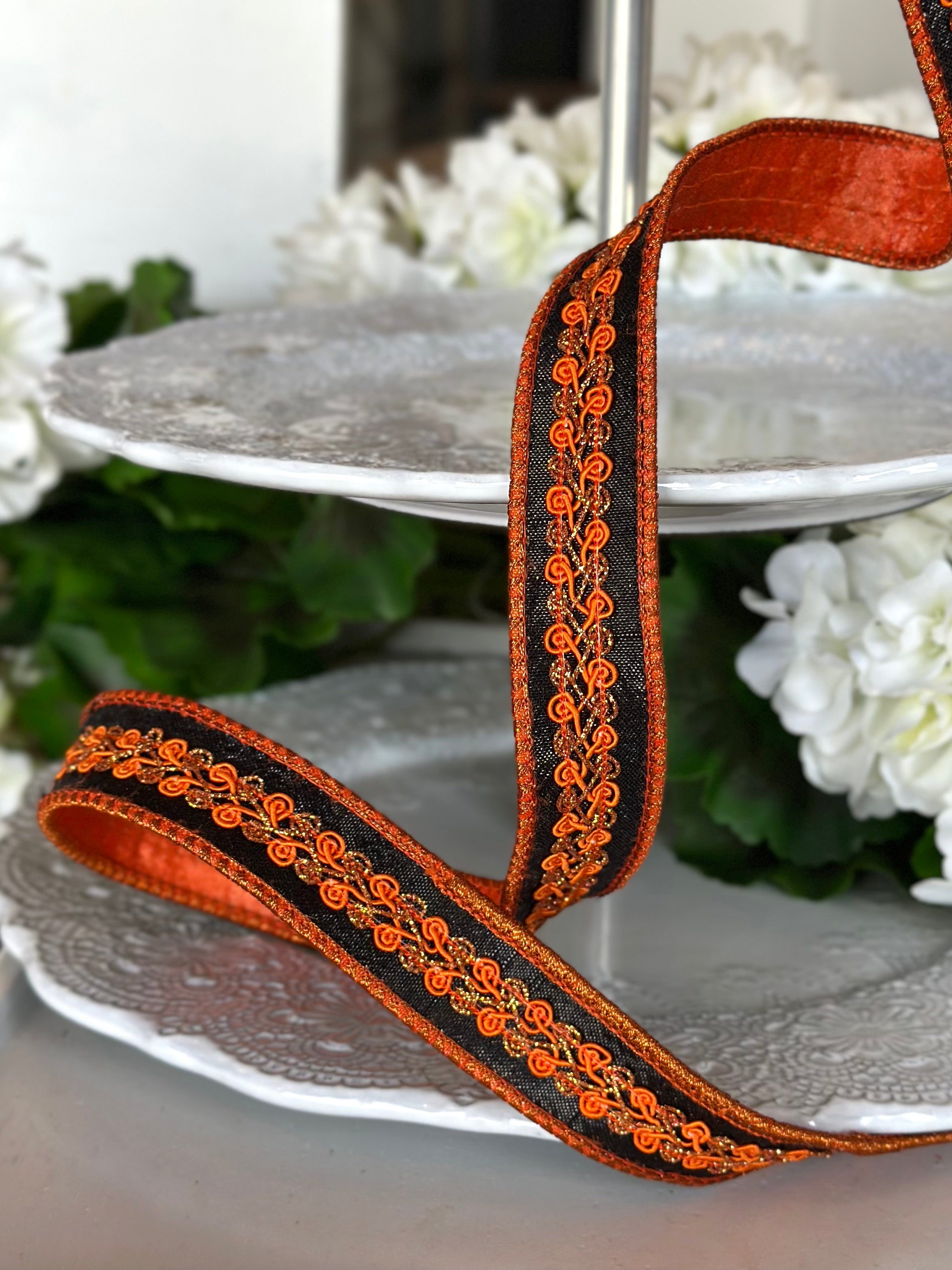 1" wide, metallic dupion orange copper center trim, black