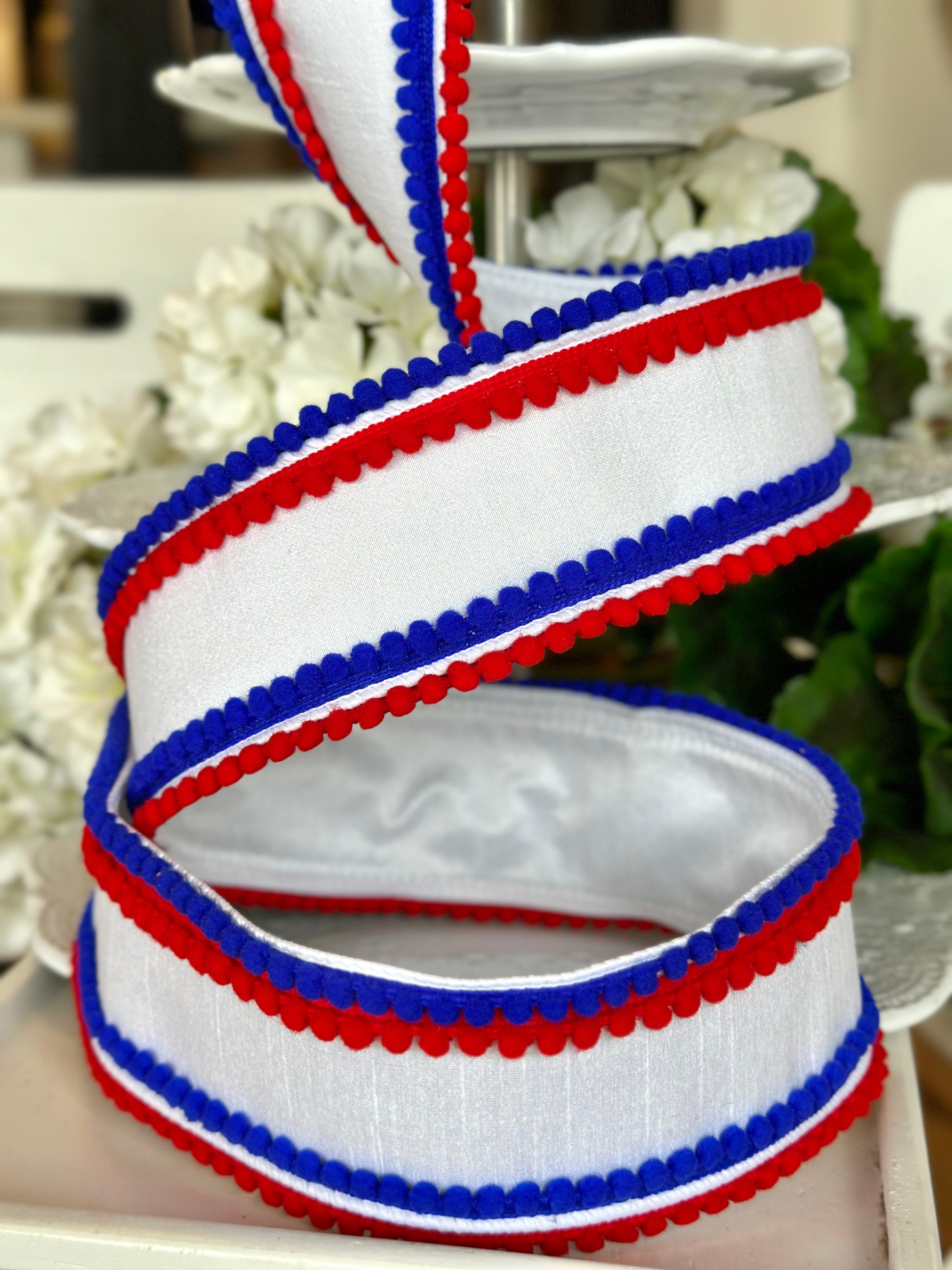 3" wide, dupion red royal blue pom pom trim, white