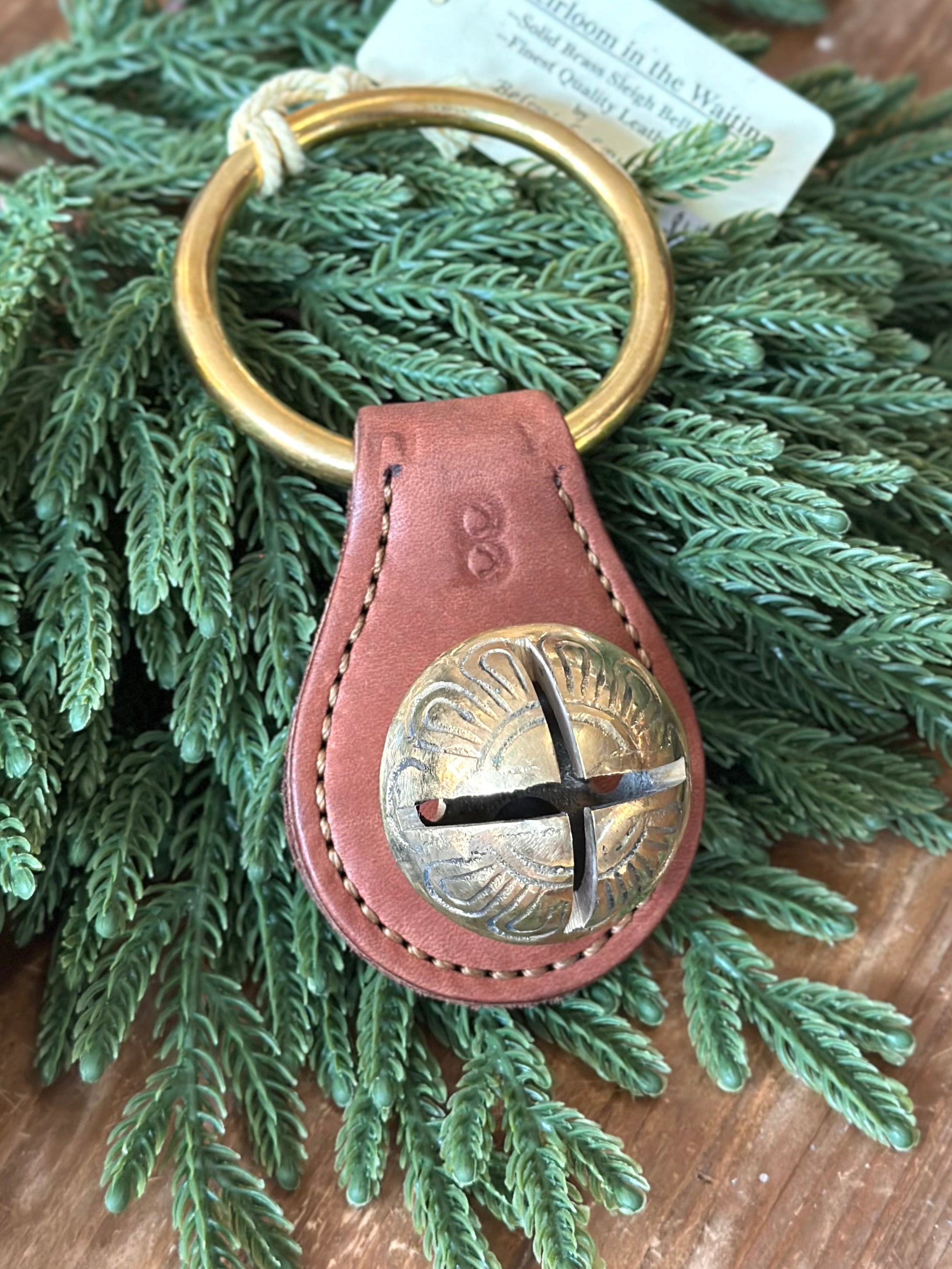 Medium Brass Bell on Brown Leather Plate with Ring