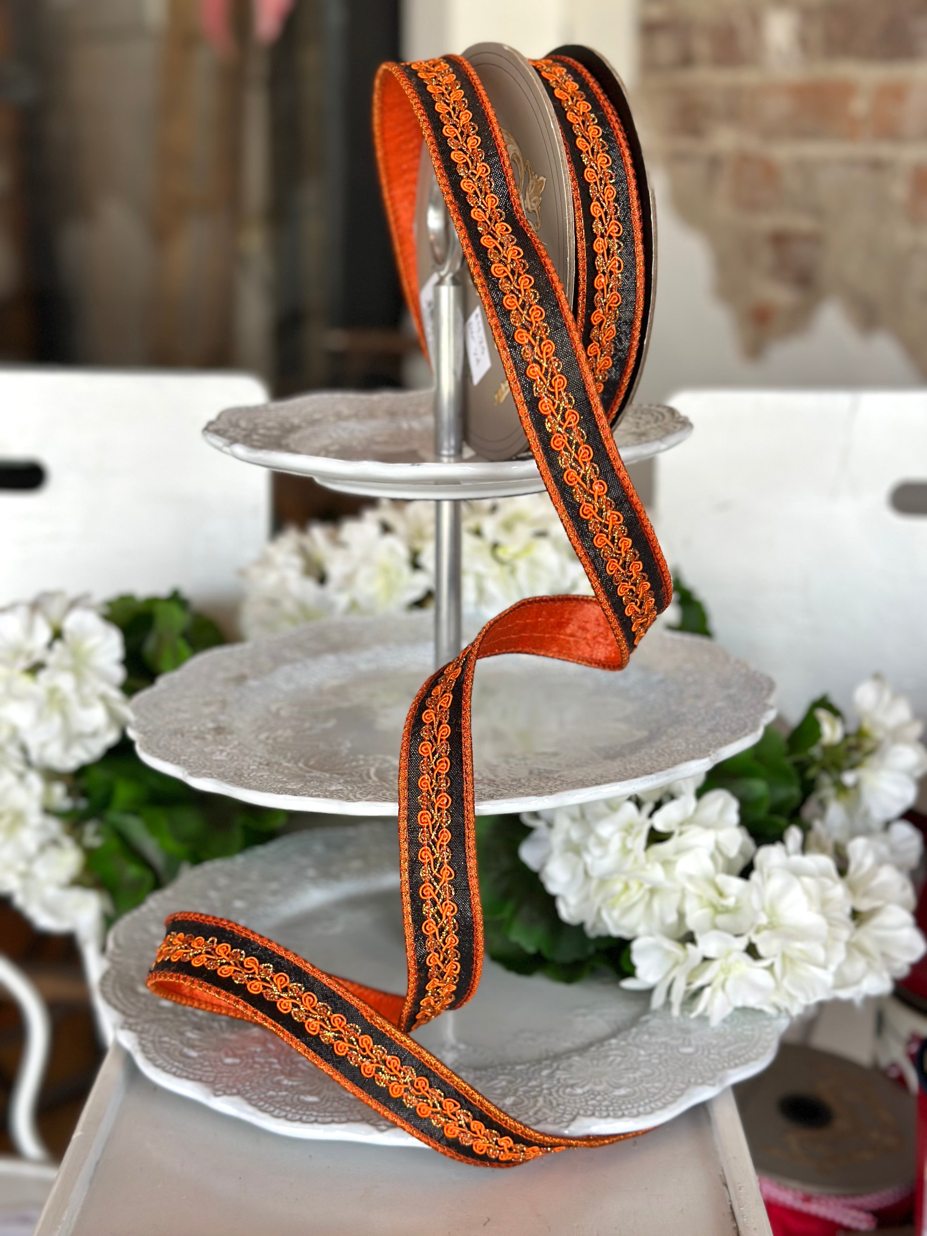 1" wide, metallic dupion orange copper center trim, black