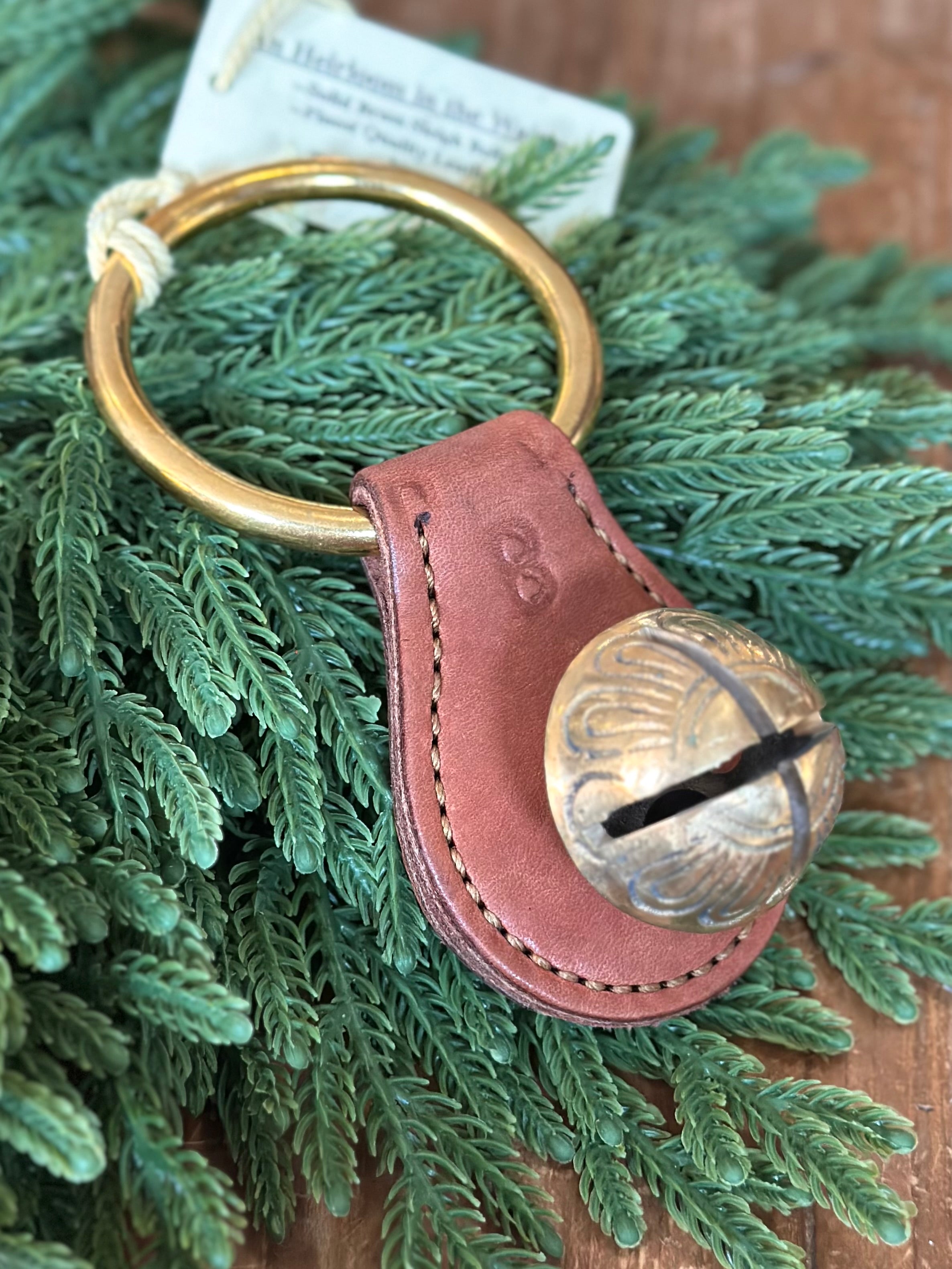 Medium Brass Bell on Brown Leather Plate with Ring