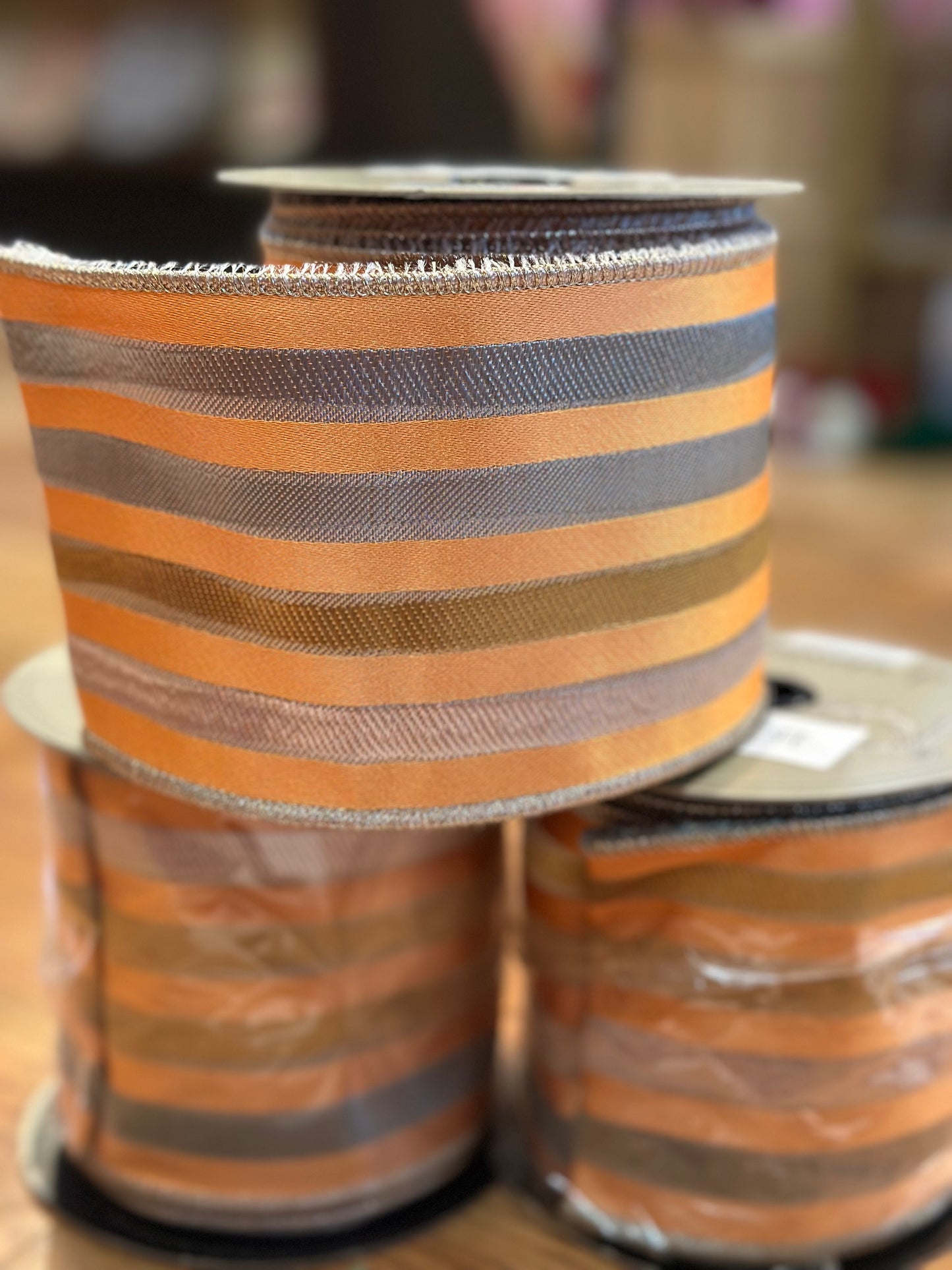 4” x 10yrds Orange ribbon with silver and gold stripes