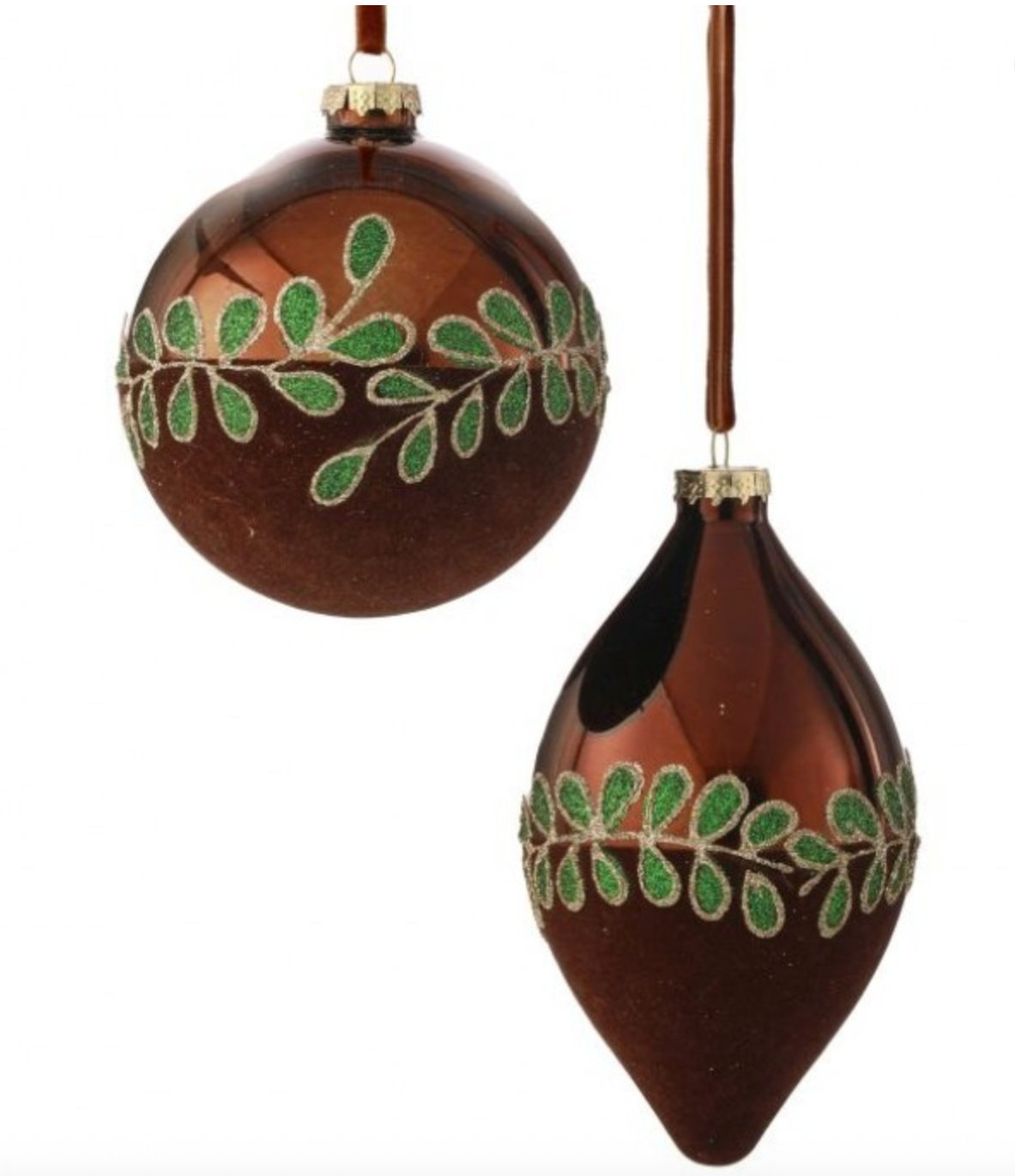 Two brown ornaments with green leaf patterns on a white background